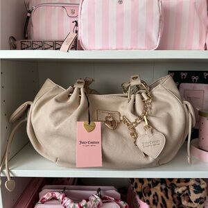 Juicy Couture Rollin On Dumpling Cream Satchel with Gold Accents